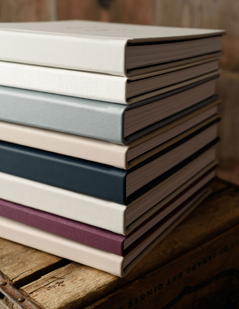 Stack of luxury albums in different colors